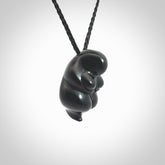 Black jade goddess pendant. Hand carved by NZ Pacific. Black Jade jewellery for sale online. Midnight Goddess is provided on a black adjustable cord and packaged in a woven kete pouch.